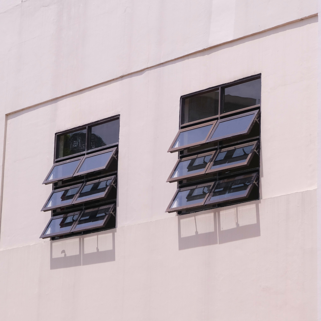 The picture features awning glass windows with a black frame. 