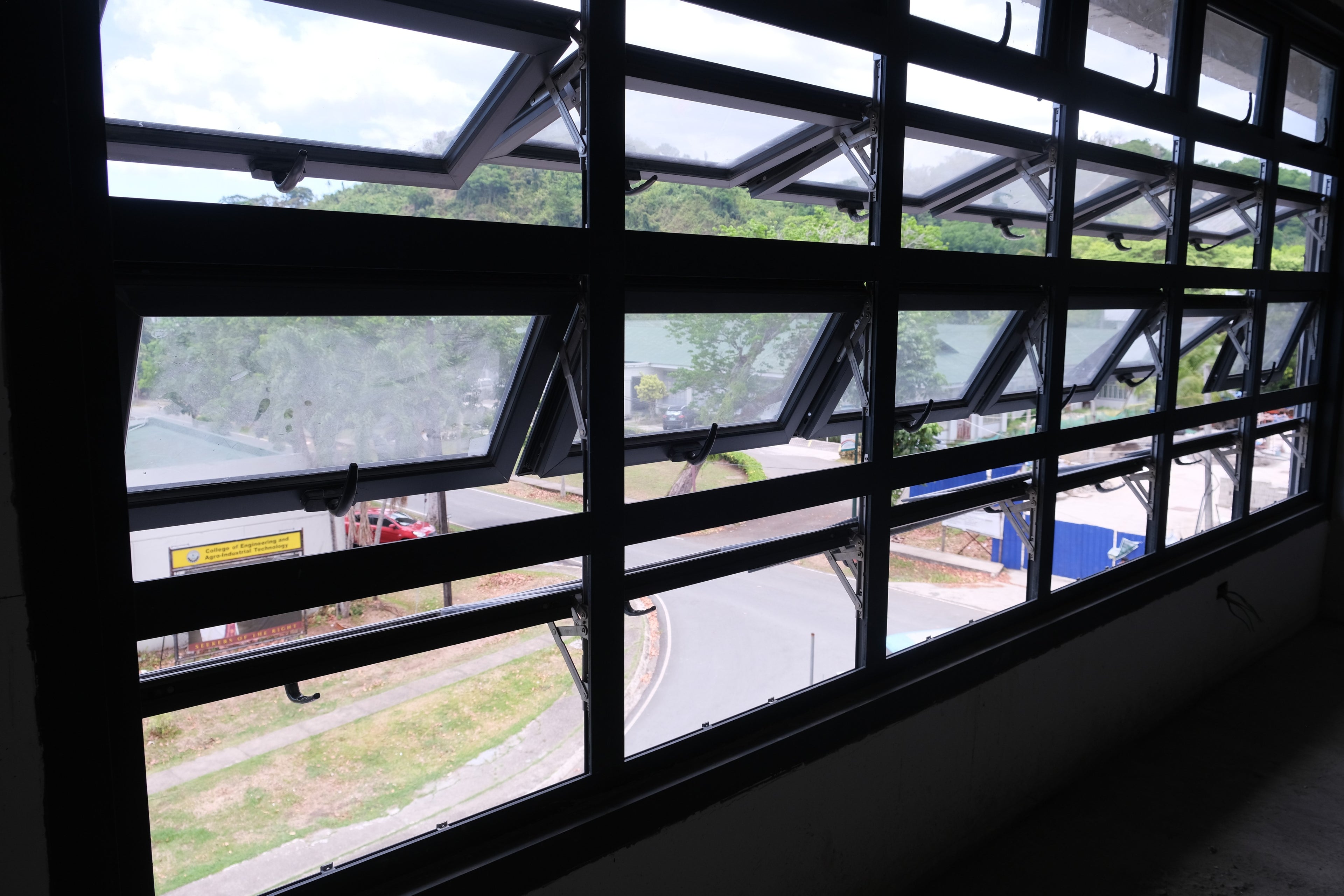 This picture shows awning windows with black panels.