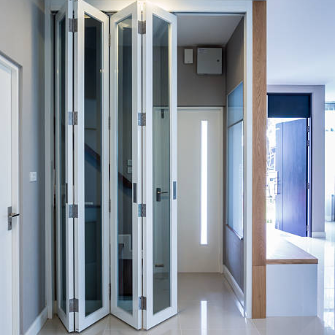 This picture shows a folding glass door with white panels.