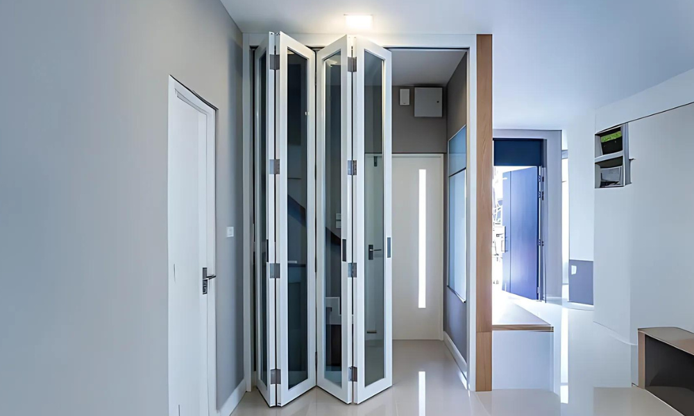 This picture shows a folding door with white panels in a residential home.