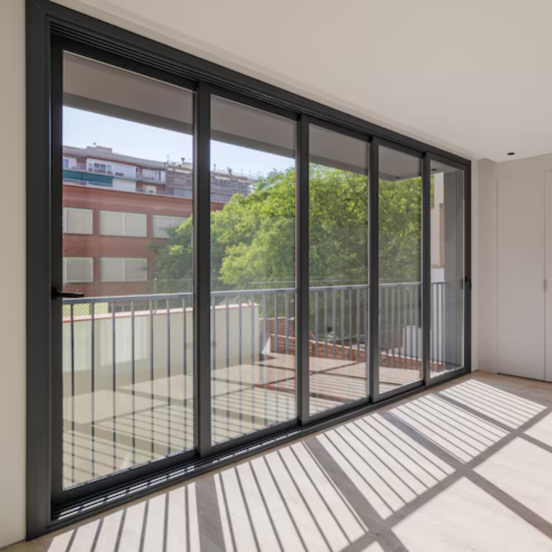 This picture shows a sliding glass door with black panels.