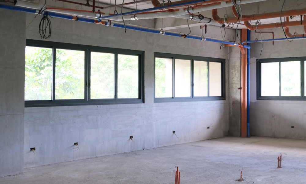 This picture shows a framed  sliding glass window with black panels.